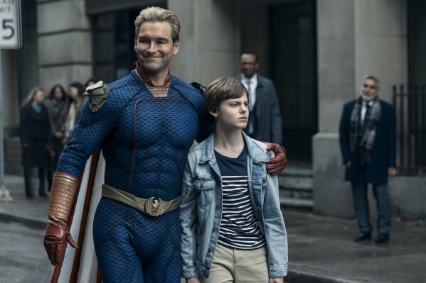 This image released by Prime Video shows Antony Starr, left, and Cameron Crovetti in a scene from the fourth season of "The Boys." (Jasper Savage/Prime Video via AP)