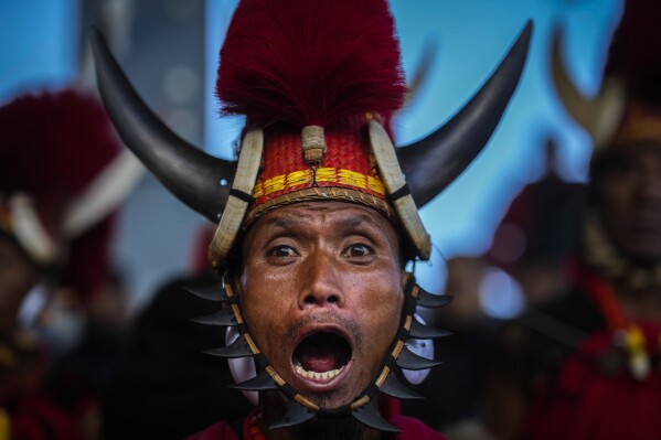 An Indigenous Naga tribal sings during the Hornbill Festival in Kisama, on the outskirts of Kohima, capital of the northeastern Indian state of Nagaland, Tuesday, Dec. 10, 2024. (AP Photo/Anupam Nath)
