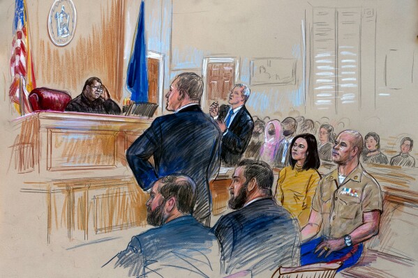 FILE - This courtroom sketch depicts Marine Maj. Joshua Mast and his wife, Stephanie, during a Circuit Court hearing before Judge Claude V. Worrell Jr., Thursday, March 30, 2023, in Charlottesville, Va. The Masts adopted an Afghan girl who was orphaned in a 2019 raid. They insist her parents were foreign fighters and the child is “stateless.” But villagers in Afghanistan say her father was a local farmer, not a militant, and he, his wife and five of their children were killed in the attack. (Dana Verkouteren via AP)