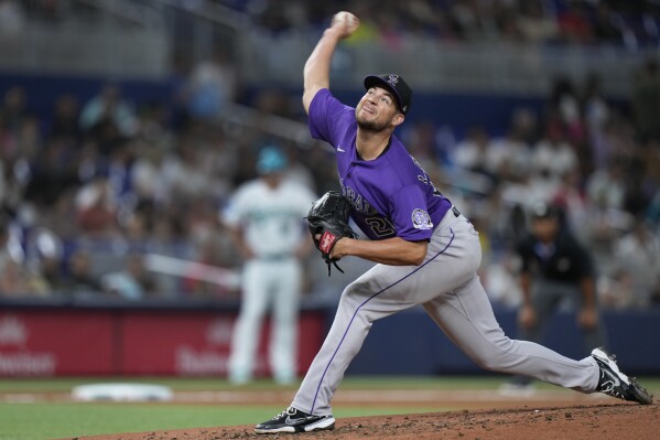 Colorado Rockies' Peter Lambert delivers a pitch during the fourth inning of a baseball game against the Miami Marlins, Friday, July 21, 2023, in Miami. (AP Photo/Wilfredo Lee)