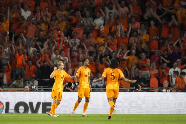 Netherlands' Cody Gakpo, center, celebrates with teammates after scoring their side's second goal during the Euro 2024 group B qualifying soccer match between Netherlands and Greece at Philips stadium in Eindhoven, Netherlands, Thursday, Sept. 7, 2023. (AP Photo/Peter Dejong)