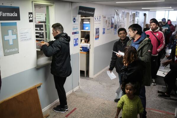 People line up to receive medicine at the Rodolfo Rossi Hospital in La Plata, Argentina, Thursday, May 8, 2025. (AP Photo/Natacha Pisarenko)