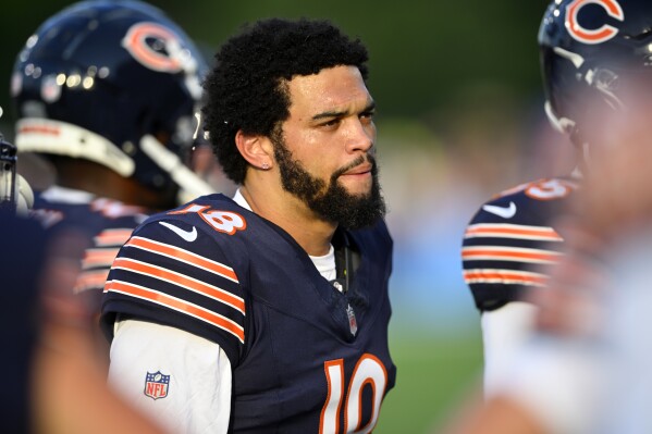 Chicago Bears quarterback Caleb Williams (18) stands on the sideline before an NFL exhibition Hall of Fame football game against the Houston Texans, Thursday, Aug. 1, 2024, in Canton, Ohio. (AP Photo/David Richard)