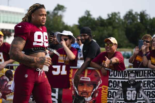 Washington Commanders defensive end Chase Young arrives for an NFL football practice at the team's training facility, Tuesday, Aug. 1, 2023, in Ashburn, Va. (AP Photo/Evan Vucci)