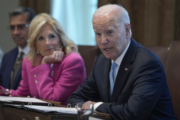 President Joe Biden, right, speaks during a meeting of his Cancer Cabinet in the Cabinet Room at the White House in Washington, Wednesday, Sept. 13, 2023. Health and Human Services Secretary Xavier Becerra, left, and first lady Jill Biden, center, listen. (AP Photo/Susan Walsh)