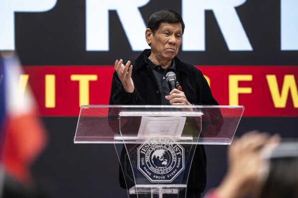 Former President of the Philippines Rodrigo Duterte speaks inside the Southorn Stadium during a thanksgiving gathering organized by Hong Kong-based Filipino workers for the former populist president in Hong Kong on Sunday, March 9, 2025. (AP Photo/Vernon Yuen)