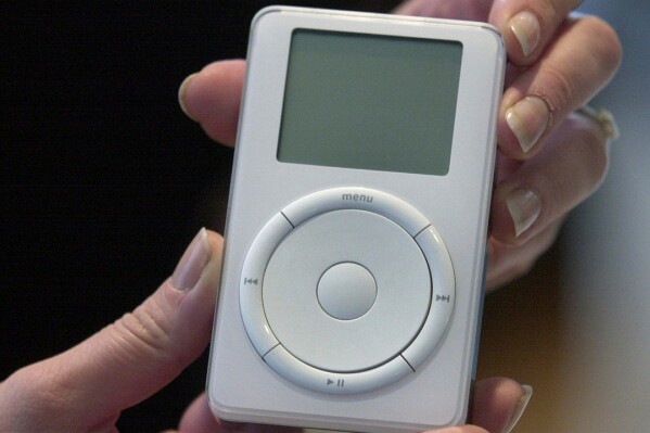 Apple's digital music player, iPod, is displayed after its introduction by Apple Computer Inc. chief executive officer Steve Jobs during a news conference, Oct. 23, 2001, in Cupertino, Calif. (AP Photo/Julie Jacobson, File)