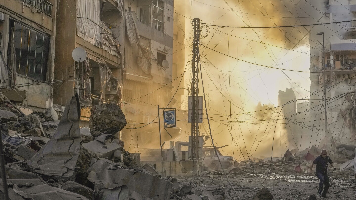 Israeli airstrikes rock Beirut and cut off key Lebanon-Syria border ...