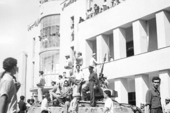 FILE -A royalist tank moves into the courtyard of Tehran Radio a few minutes after pro-shah troops occupied the area during the coup which ousted Mohammad Mosaddegh and his government on Aug. 19, 1953. In August 1953, a CIA-backed coup toppled Iran's prime minister, cementing the rule of Shah Mohammad Reza Pahlavi for over 25 years before the 1979 Islamic Revolution. (AP Photo, File)