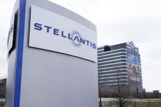 FILE - A Stellantis sign stands outside the Chrysler Technology Center in Auburn Hills, Mich., Jan. 19, 2021. Stellantis is teaming with Archer Aviation to create an electric aircraft. Stellantis will provide its advanced manufacturing technology and expertise, experienced personnel and capital to the joint project. (AP Photo/Carlos Osorio, File)