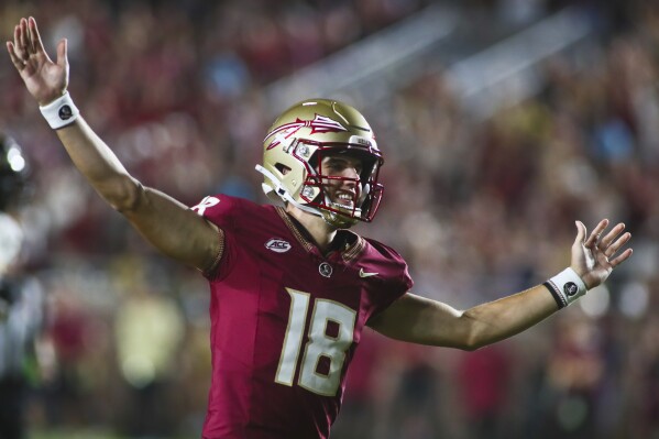 Florida State quarterback Tate Rodemaker (18) celebrates after throwing a touchdown pass to tight end Markeston Douglas in the third quarter of an NCAA college football game against Southern Mississippi, Saturday, Sept. 9, 2023, in Tallahassee, Fla. FSU won 66-13. (AP Photo/Phil Sears)