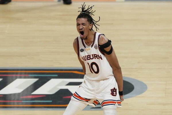 Auburn's Chad Baker-Mazara (10) celebrates during the first half in the national semifinals at the Final Four of the NCAA college basketball tournament, Saturday, April 5, 2025, in San Antonio. (AP Photo/Stephanie Scarbrough, file)