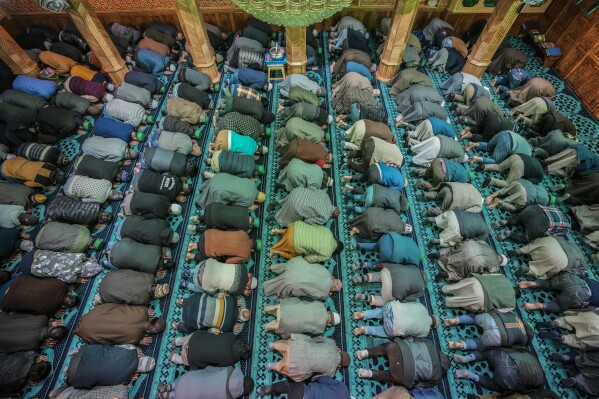 Muslims offer prayer inside a Mosque on the first day of Ramadan, in Srinagar, Indian controlled Kashmir, Tuesday, March 12, 2024. The Muslim holy month of Ramadan, when the faithful fast from dawn to dusk, began at sunrise Tuesday in much of Asia. (AP Photo/Mukhtar Khan)