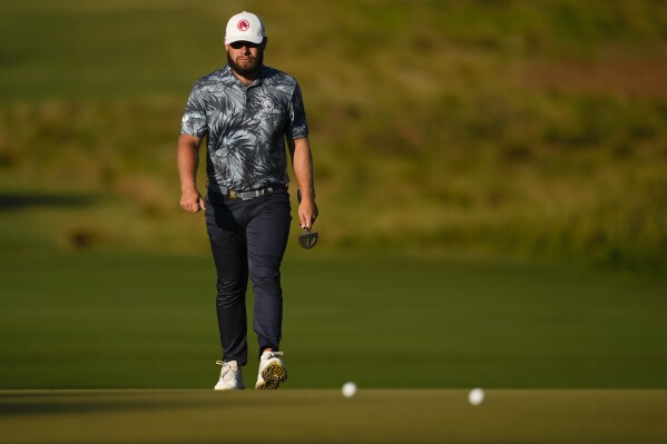 Tyrrell Hatton, of England, walks to the green on the first hole during the second round of the U.S. Open golf tournament Friday, June 14, 2024, in Pinehurst, N.C. (AP Photo/Matt York)
