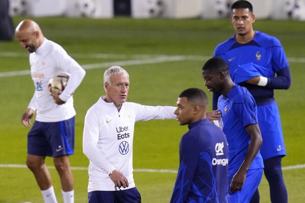 France's head coach Didier Deschamps talks to his players during the training session at the Jassim Bin Hamad stadium in Doha, Qatar, Friday, Dec. 16, 2022. France will play against Argentina during their World Cup final soccer match on Dec. 18. (AP Photo/Petr David Josek)