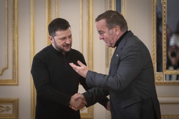 Ukrainian President Volodymyr Zelenskyy, left, and German Defence Minister Boris Pistorius greet each other in Kyiv, Ukraine, Tuesday, Jan. 14, 2025. (AP Photo/Efrem Lukatsky)