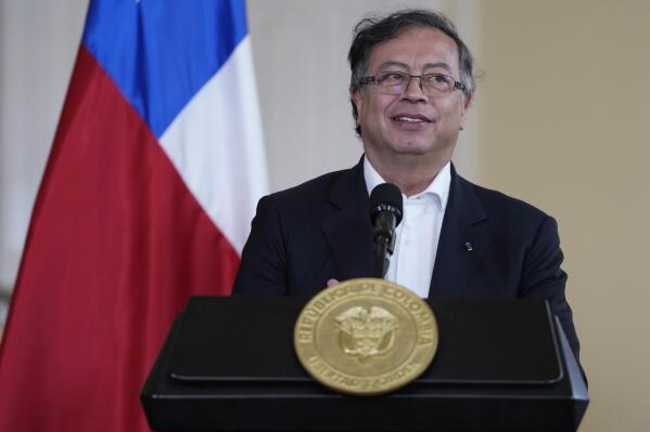 Colombian President Gustavo Petro gives a joint press conference with Chile's President Gabriel Boric at the presidential Narino Palace in Bogota, Colombia, Monday, Aug. 8, 2022. (AP Photo/Fernando Vergara)