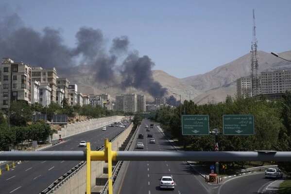 Smoke rises from an oil storage facility after it appeared to have been struck by an Israeli strike on Saturday, in Tehran, Iran, Monday, June 16, 2025. (AP Photo/Vahid Salemi)