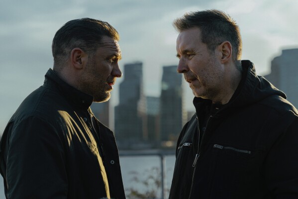 This image released by Paramount+ shows Tom Hardy, left, and Paddy Considine in a scene from "Mobland." (Luke Varley/Paramount+ via AP)