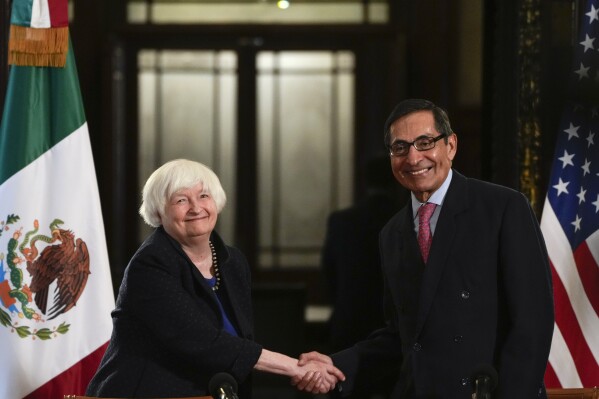 U.S. Treasury Secretary Janet Yellen and the Mexican Secretary of Finance Rogelio Ramirez de la O shake hands after a news conference at the National Palace in Mexico City, Thursday, Dec. 7, 2023. (AP Photo/Fernando Llano)