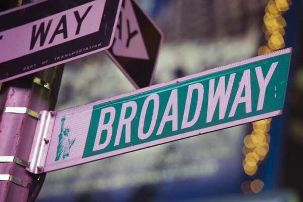 FILE - This Jan. 19, 2012 file photo shows a Broadway street sign in New York. The Broadway League and Disney Theatrical Productions, which represent producers, and the International Alliance of Theatrical Stage Employees announced Thursday they had reached a tentative agreement that had threatened a strike as early as Friday. (AP Photo/Charles Sykes, File)