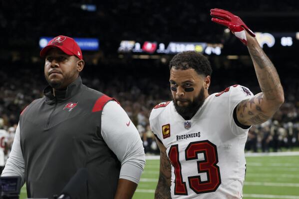 Tampa Bay Buccaneers wide receiver Mike Evans leaves the field after being thrown out of the game against the New Orleans Saints during the first half of an NFL football game in New Orleans, Sunday, Sept. 18, 2022. (AP Photo/Butch Dill)