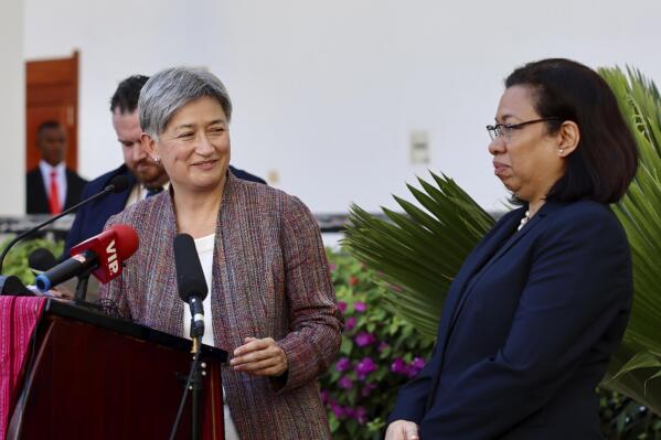In this photo provided by the Australian Department of Foreign Affairs and Trade Minister Penny Wong, left, comments while East Timor's Foreign Minister Adaljiza Magno listens during a visit to Dili, East Timor, Thursday, Sept. 1, 2022. Wong has warned East Timor against going into debt to the Chinese to develop a major gas project. (Sarah Friend/Department of Foreign Affairs and Trade via AP)
