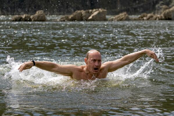 Then-Russian Prime Minister Vladimir Putin swims while in the Siberian region of Tuva during a vacation on Monday, Aug. 3, 2009. Putin sent Russian forces into Ukraine on Feb. 24, 2022, and appears determined to prevail -- ruthlessly and at all costs. (Alexei Druzhinin, Sputnik, Kremlin Pool Photo via AP, File)