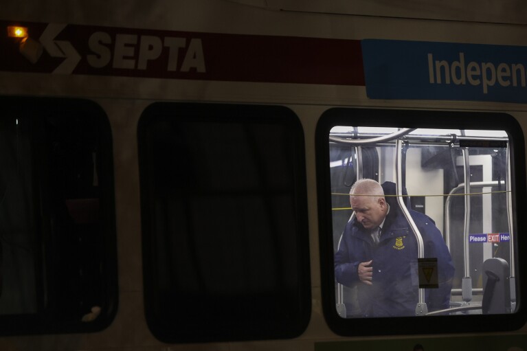 Police respond to a deadly shooting on a SEPTA bus in South Philadelphia on Tuesday, March 5, 2024. A passenger shot aboard the bus has died from his wounds, marking the third time in three days that someone was killed while riding, entering or leaving a SEPTA bus. (Heather Khalifa/The Philadelphia Inquirer via AP)