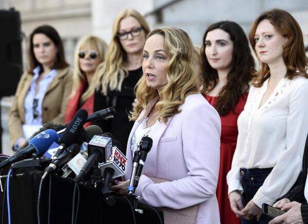 FILE - Actress Louisette Geiss speaks at a news conference by the "Silence Breakers," a group of women who have spoken out about Hollywood producer Harvey Weinstein's sexual misconduct, at Los Angeles City Hall, on Feb. 25, 2020, in Los Angeles. Geiss, a former actress and screenwriter who accused Weinstein in 2017, has written a musical stemming from her experiences with Weinstein. “The Right Girl,” which was waylaid by the pandemic but will be produced live onstage sometime in 2023. (AP Photo/Chris Pizzello, File)