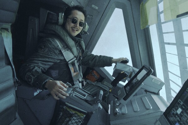 This image released by Warner Bros. Pictures shows Steven Yeun in a scene from "Mickey 17." (Warner Bros. Pictures via AP)