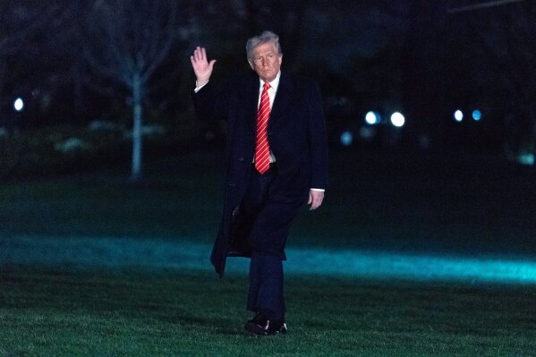 President Donald Trump waves to the media as he walks on the South Lawn of the White House, in Washington, Saturday, March 22, 2025. (AP Photo/Jose Luis Magana)