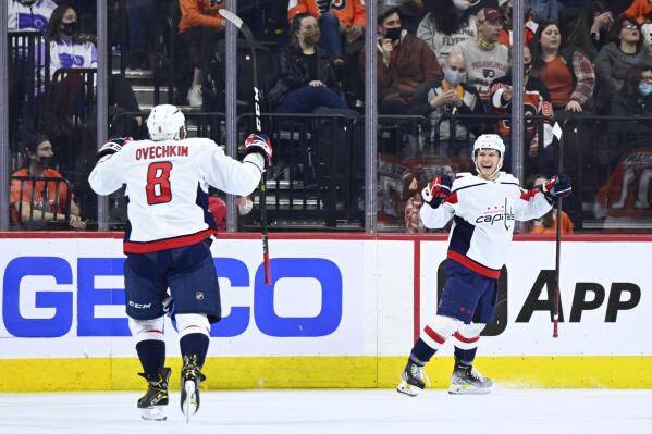 Washington Capitals' Joe Snively, right, celebrates with Alex Ovechkin (8) after scoring a goal during the second period of an NHL hockey game against the Philadelphia Flyers, Thursday, Feb. 17, 2022, in Philadelphia. (AP Photo/Derik Hamilton)