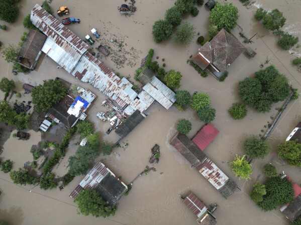 FILE - Floodwaters cover a farm and a house after the country's record rainstorm in the village of Kastro, near Larissa, Thessaly region, central Greece, Sept. 7, 2023. Before crossing the Mediterranean, the devastating storm that dumped torrential rains along the Libyan coast raged for days and caused extensive damage in central Greece and parts of Bulgaria and Turkey, a region where such extreme storms are up to 10 times more likely and up to 40% more intense because of climate change, scientists said. (AP Photo/Vaggelis Kousioras, File)