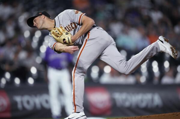 San Francisco Giants relief pitcher Tyler Rogers works against the Colorado Rockies during the second inning of a baseball game Tuesday, Sept. 20, 2022, in Denver. (AP Photo/David Zalubowski)