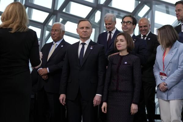 From second left, Portugal's Prime Minister Antonio Costa, Poland's President Andrej Duda, Norway's Prime Minister Jonas Gahr Store and Moldova's President Maia Sandu pose during a group photo at the Council of Europe summit in Reykjavik, Iceland, Tuesday, May 16, 2023. Leaders from across the continent are laser-focused on holding Russia to account for its invasion of Ukraine and were poised to approve a system during their Council of Europe summit that would precisely establish the damages Moscow would have to pay to rebuild the nation. (AP Photo/Alastair Grant, Pool)