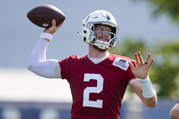 Indianapolis Colts quarterback Carson Wentz (2) throws during practice at the NFL team's football training camp in Westfield, Ind., Monday, Aug. 23, 2021. (AP Photo/Michael Conroy)