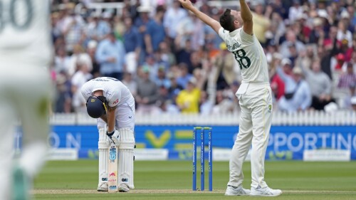 England's captain Ben Stokes, left, reacts after he is dismissed by Australia's Josh Hazlewood, right, during the fifth day of the second Ashes Test match between England and Australia, at Lord's cricket ground in London, Sunday, July 2, 2023. (AP Photo/Kirsty Wigglesworth)