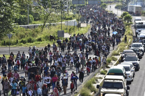 Migrants who had been waiting for temporary transit papers, but failed to get them after waiting, some up to two months, leave Tapachula, Mexico, Monday, Oct. 30, 2023, as they make their way to the U.S. border. The migrants said they did not have the resources to pay for food and lodging to wait any longer. (AP Photo/Edgar Clemente)