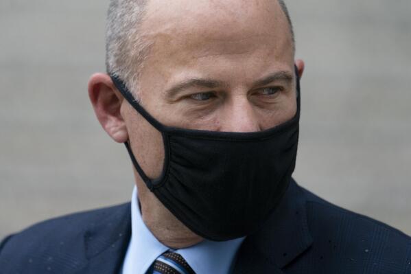Michael Avenatti departs a scheduled sentencing at Manhattan federal court, Thursday, July 8, 2021, in New York. A New York judge has sentenced the combative California lawyer Avenatti to 2 1/2 years in prison for trying to extort up to $25 million from Nike. U.S. District Judge Paul G. Gardephe announced the sentence Thursday in Manhattan, where a jury in early 2020 convicted Avenatti of charges including attempted extortion and fraud. (AP Photo/John Minchillo)