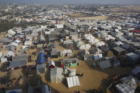 A view of the makeshift tent camp where Palestinians displaced by the Israeli bombardment of the Gaza Strip are staying in the Muwasi area on Monday, Jan. 1, 2024. (AP Photo/Hatem Ali)