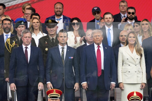 President Donald Trump, first lady Melania Trump, Secretary of the Army Daniel Driscoll, left and Defense Secretary Pete Hegseth attend a military parade commemorating the Army's 250th anniversary, coinciding with his 79th birthday, Saturday, June 14, 2025, in Washington. (AP Photo/Julia Demaree Nikhinson)