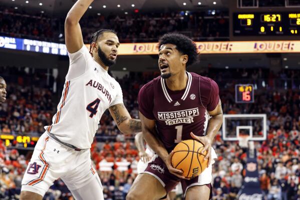 Mississippi State forward Tolu Smith (1) looks for a shot as Auburn forward Johni Broome (4) defends during the first half of an NCAA college basketball game Saturday, Jan. 14, 2023 in Auburn, Ala.. (AP Photo/Butch Dill)