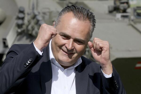 FILE - Then Austrian defense minister Hans Peter Doskozil reacts during a joint military exercise in Allensteig, Austria, Friday, Sept. 15, 2017. Austria’s main center-left opposition party has reversed the result of its weekend leadership election, announcing that a computer error originally led to the wrong candidate being declared the winner. At a hastily called news conference on Monday, the head of the party's electoral commission announced that it was in fact Andreas Babler and not Hans Peter Doskozil who won, taking 317 votes to Doskozil's 280, the Austria Press Agency reported. (AP Photo/Ronald Zak, File)