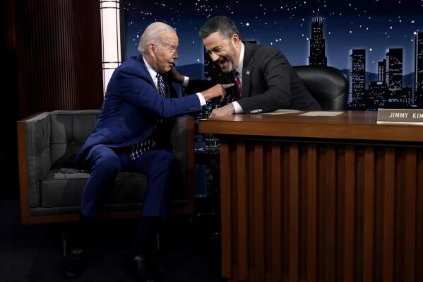 President Joe Biden speaks with host Jimmy Kimmel during a commercial break during the taping of Jimmy Kimmel Live!, Wednesday, June 8, 2022, in Los Angeles prior to attending the Summit of the Americas. (AP Photo/Evan Vucci)
