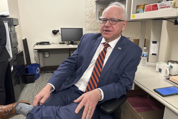 Gov. Tim Walz is photographed in the press room at the State Capitol, on March 13, 2024, in St. Paul, Minn. Minnesota has joined a growing list of states that plan to count prisoners at their home addresses instead of at the prison or jail they’re located when drawing new political districts. (AP Photo/Steve Karnowski, File)