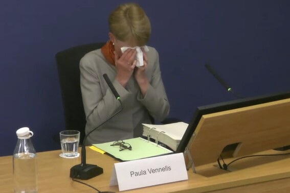 Screen grab taken from the Post Office Horizon IT Inquiry of former Post Office boss Paula Vennells becoming tearful for a second time whilst giving evidence to the inquiry at Aldwych House, as part of phases five and six of the probe, which is looking at governance, redress and how the Post Office and others responded to the scandal, in central London on Wednesday May 22, 2024. (Post Office Horizon IT Inquiry/PA via AP)