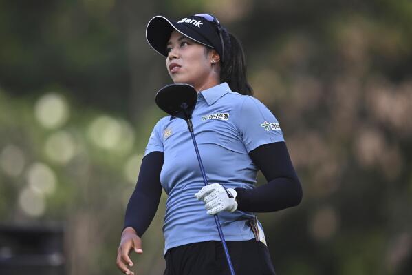 Patty Tavatanakit of Thailand watches her shot on the 14th hole during the final round of the LPGA Honda Thailand golf tournament in Pattaya, southern Thailand, Sunday, March 13, 2022. (AP Photo/Kittinun Rodsupan)