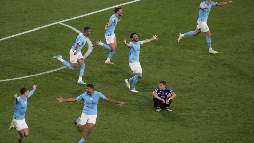 Manchster City players celebrate their 1-0 win at the end of the Champions League final soccer match between Manchester City and Inter Milan at the Ataturk Olympic Stadium in Istanbul, Turkey, Saturday, June 10, 2023. (AP Photo/Thanassis Stavrakis)
