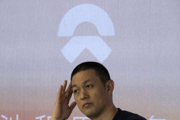 NIO Chairman William Li speaks during an event at the company flagship store in Beijing on Thursday, Aug. 20, 2020. The chairman of Chinese electric car brand NIO says it plans to start expanding to Western markets next year. William Li said the company might export a battery-swapping service already offered in China that might help it compete with rival Tesla. (AP Photo/Ng Han Guan)